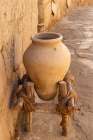 Saudi Arabia, Tabuk Province, Tayma. An amphora on a stand at a desert oasis. Art Print